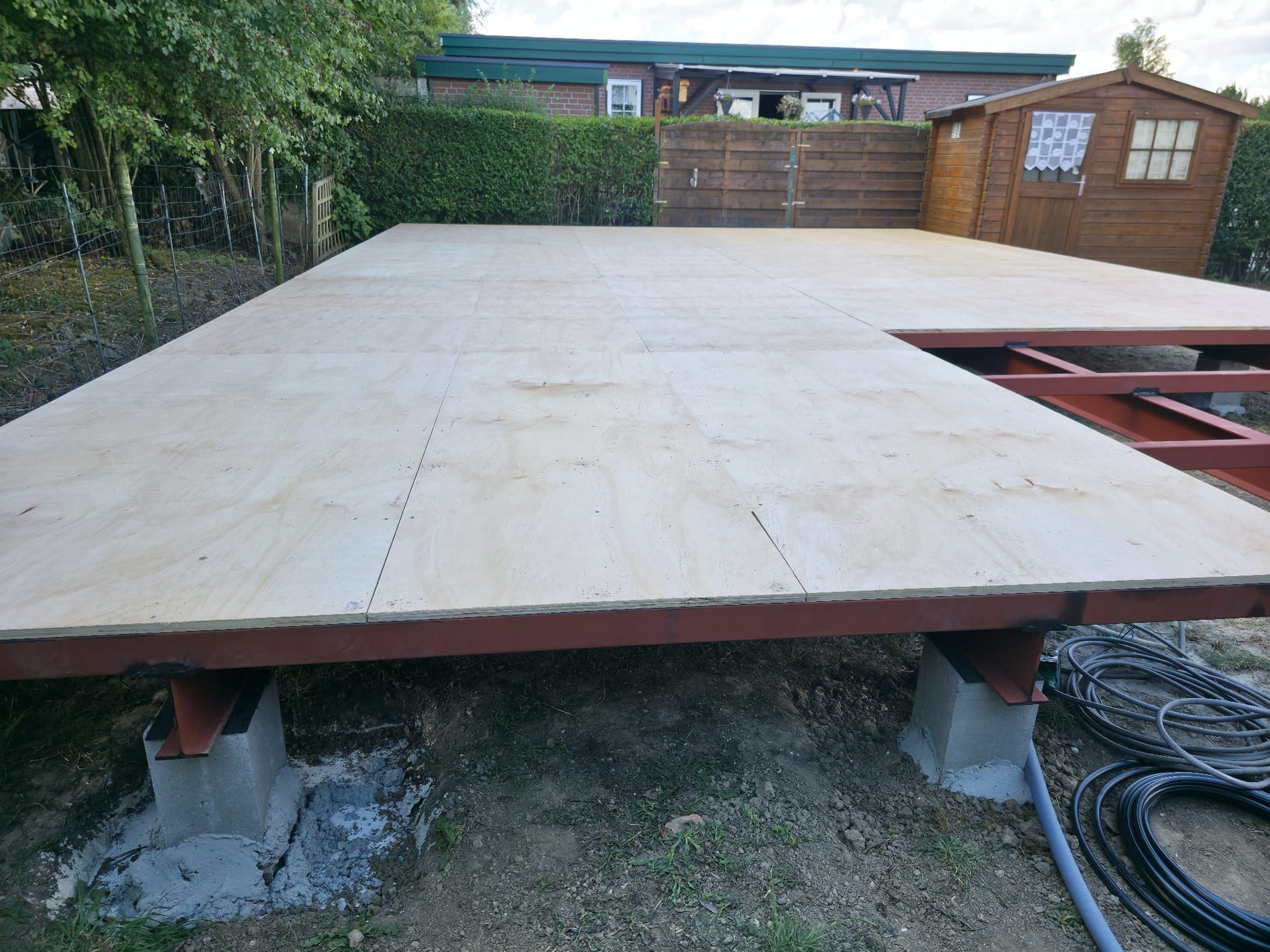 Finished flat base platform on steel frame and concrete piers, ready for the structure