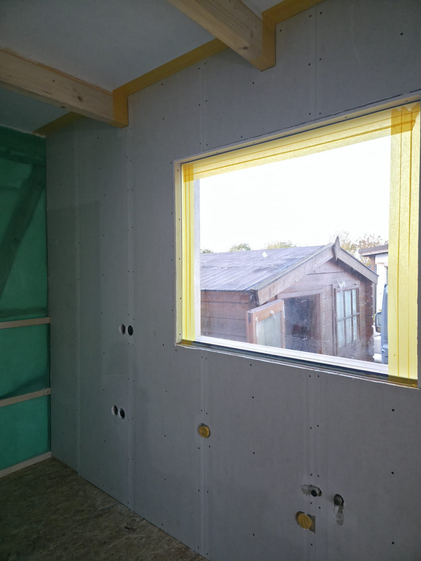 Interior wall boards and window detailing during finishing