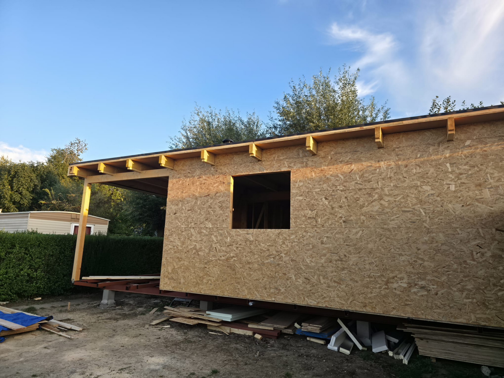 OSB exterior sheathing fitted around window and doorway openings