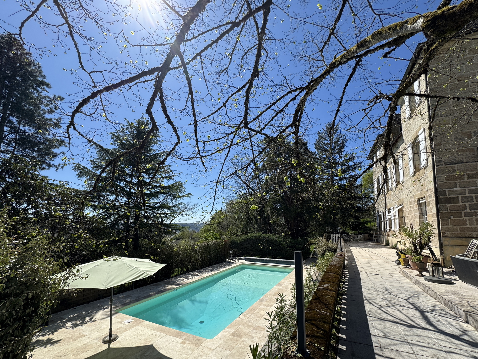 Renovated swimming pool beside a stone villa in France