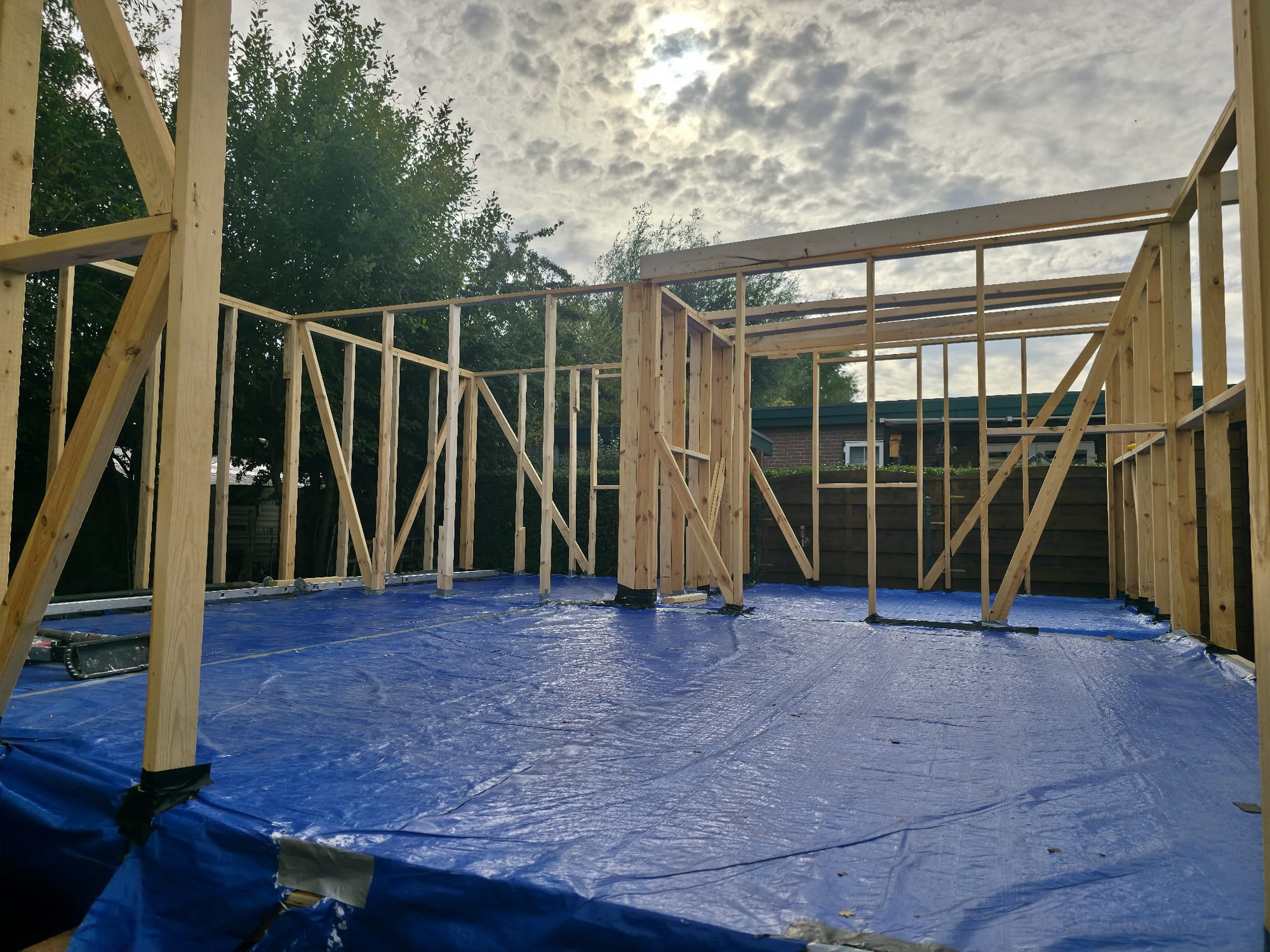 Interior view of the timber wall framing erected on the protected floor
