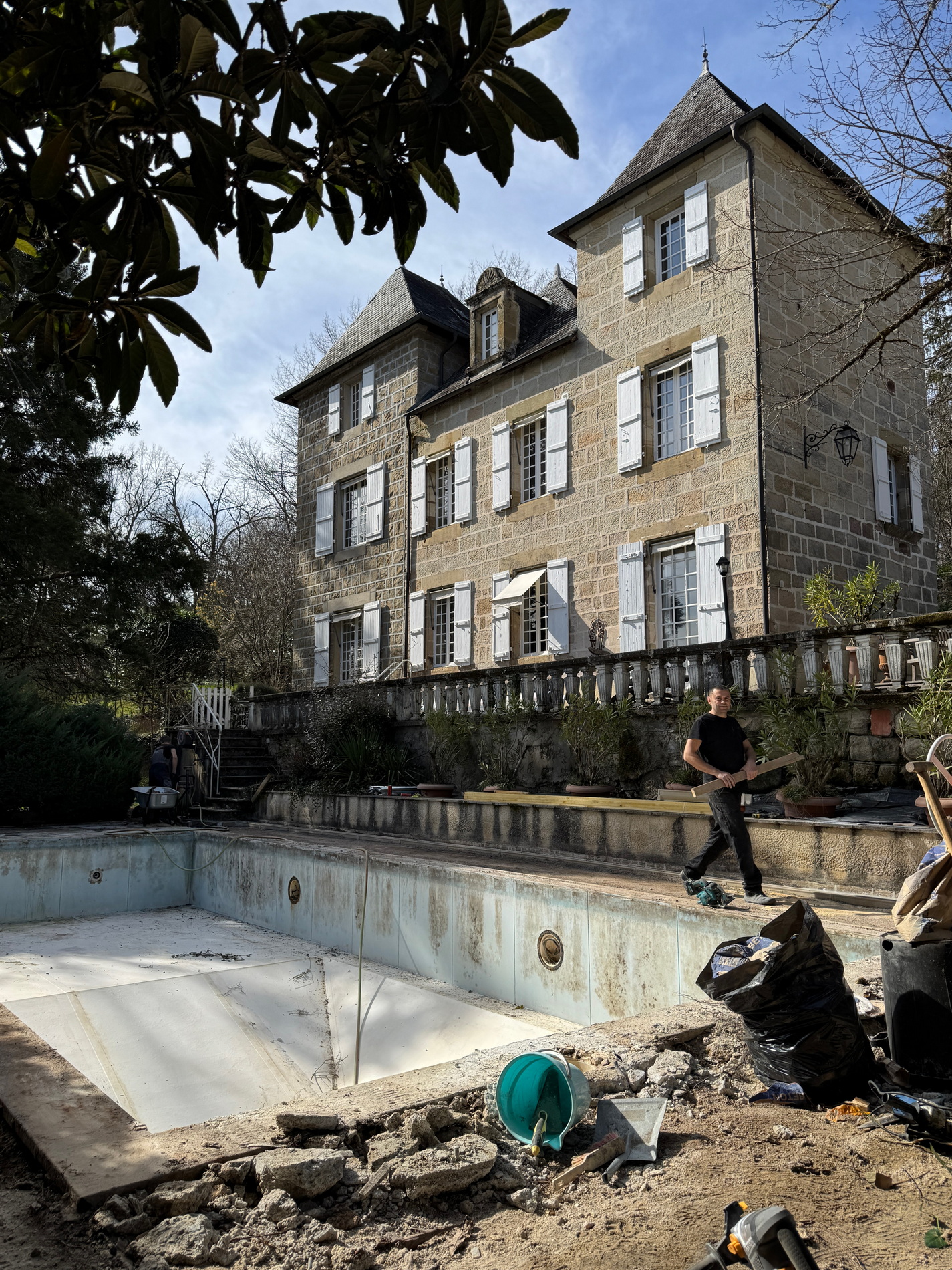 Stone villa with renovated pool terrace and new stone paving by NIVA BUILDING