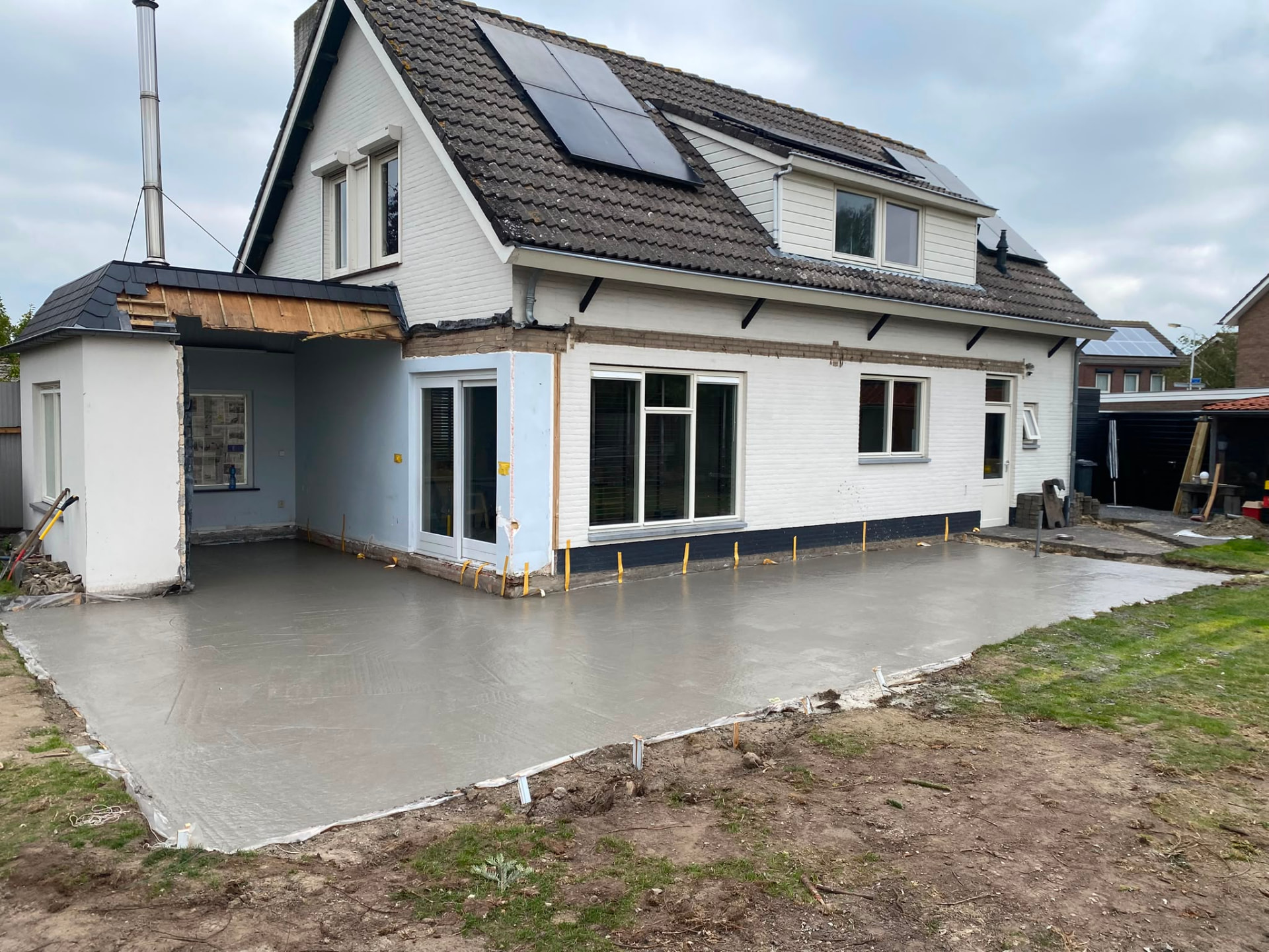 New concrete floor slab poured at a house extension