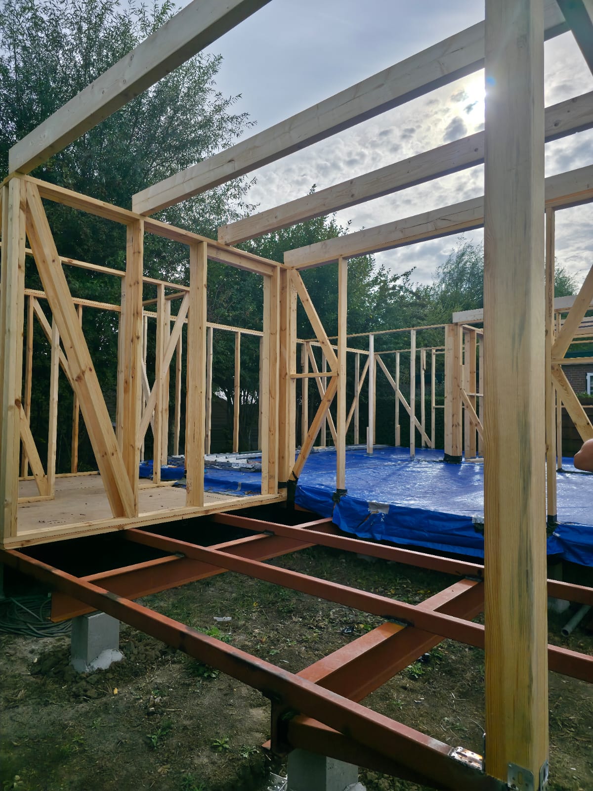 Close view of the timber wall and roof structure during construction
